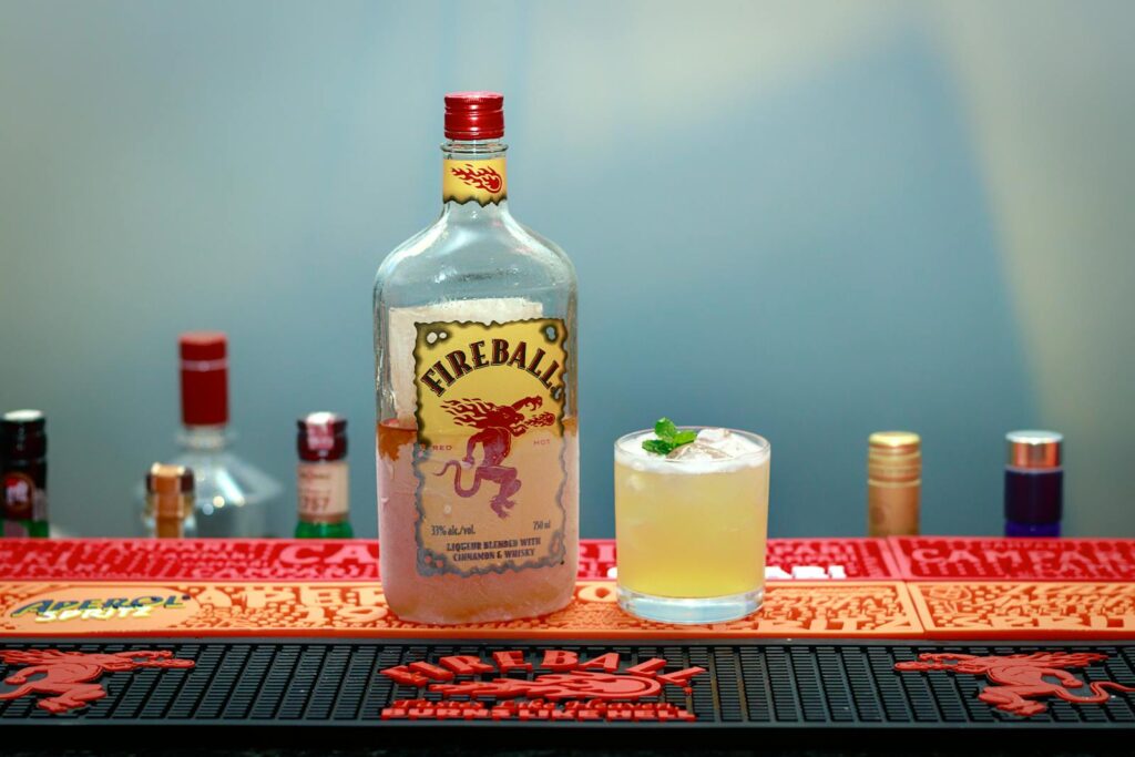 Bottle and Glass of Vodka Fireball whiskey